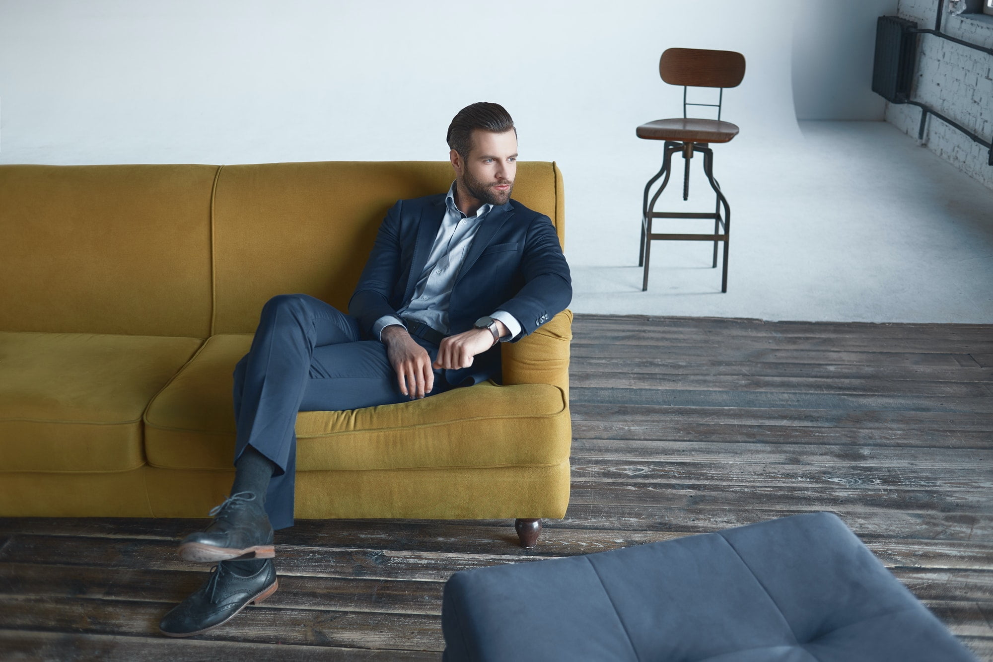 Stylish young man in a suit. Business style. Fashionable image. Evening dress. Sexy man standing and